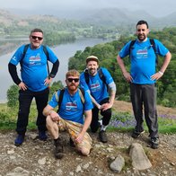 A group of veterans at the top of a mountain during the Cumbrian Challenge event