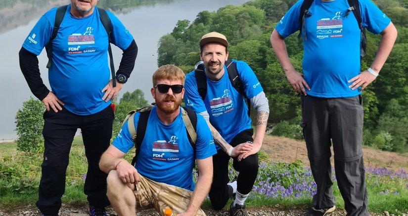 A group of veterans at the top of a mountain during the Cumbrian Challenge event