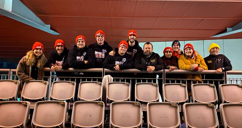 CEO Sleepout participants in the stands looking at the camera