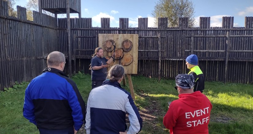A group of veterans taking part in an archery class